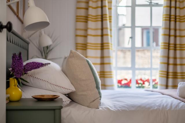 Luxury curtains and bedding with john lewis bed and bed head stylish beside lights and window views from the bed to the river Lym, peaceful sounds of the river running by
