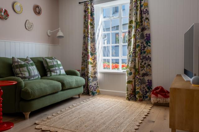 The dining room and lounge refurbished with a luxury style with designer sofas and curtains, sky glass TV and views of the river a perfect holiday getaway for two or a solo traveller