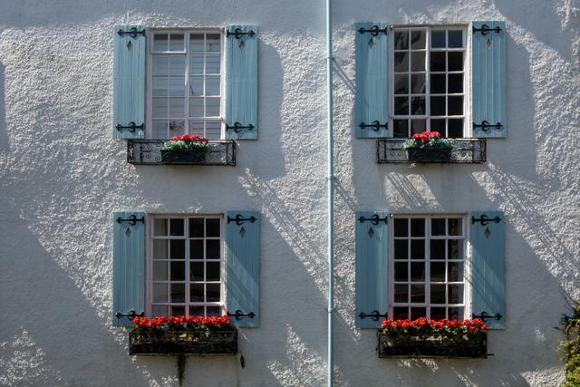 The exterior blue shutters of this holiday property dating back to 18th century, a period property with stylish interiors views of the river and walks 