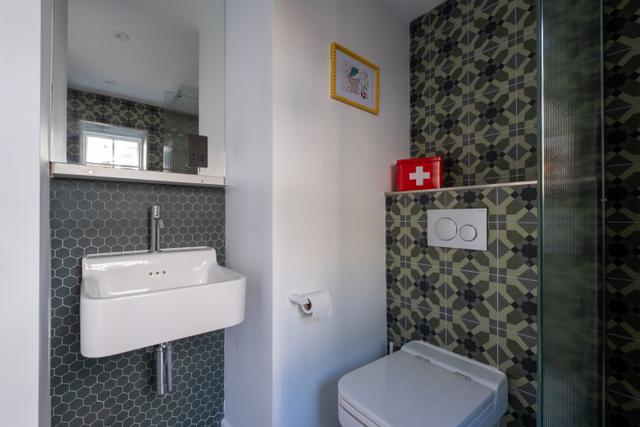 Stylish and modern scandi style toilet and sink in the showeroom of this holiday stay