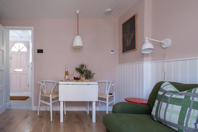 Cosy open plan lounge and dining with luxury sofa and designer interiors a boutique living space for two people 