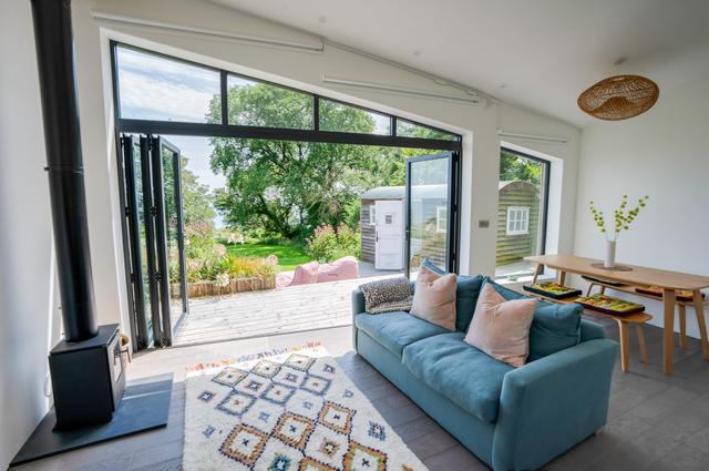 Lounge & dining room table with breath taking views from a wall of windows