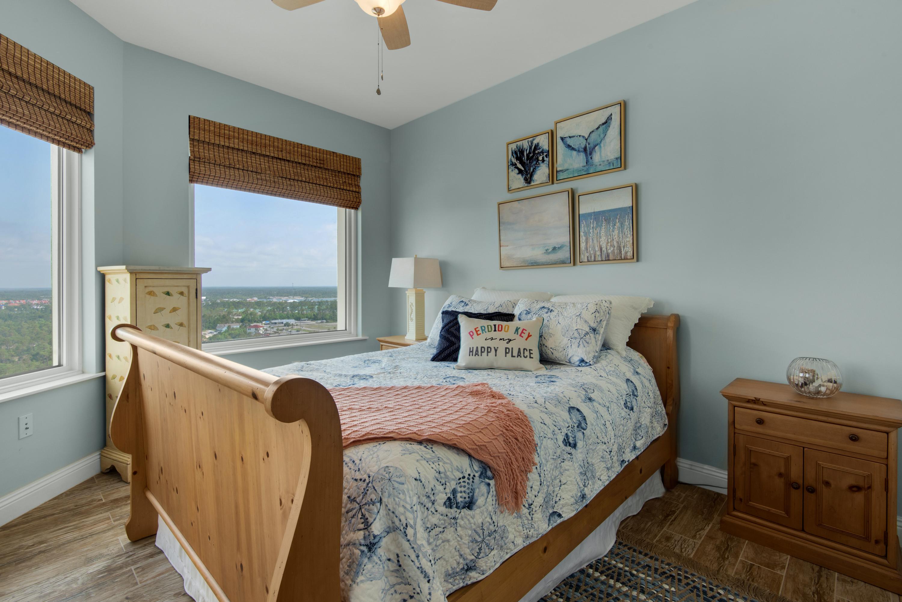 Large guest room with queen bed and great views of the back bays and a balcony