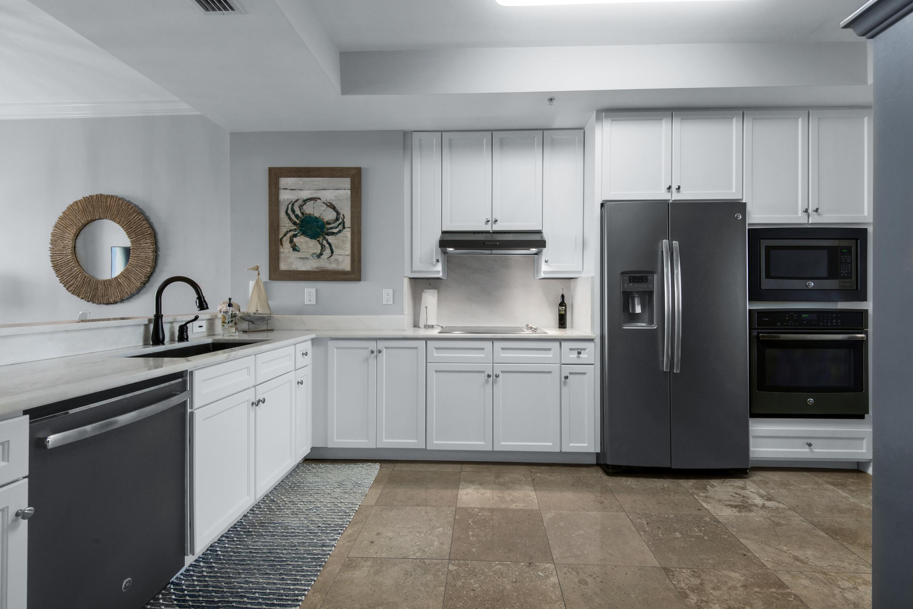 Supremely decorated and appointed kitchen, with striking white quartz counters