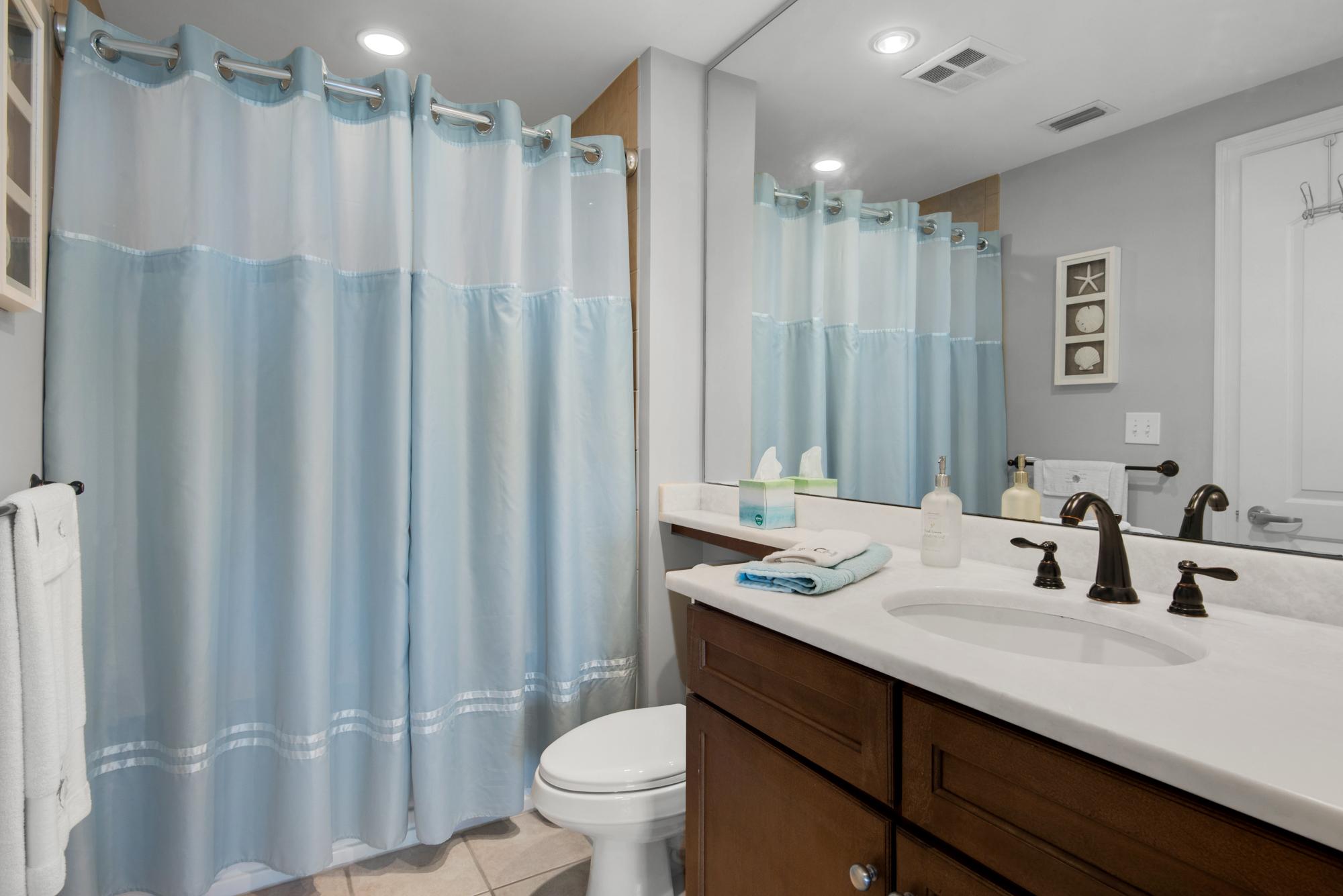 Tastefully decorated bathroom for guests and for queen bedroom