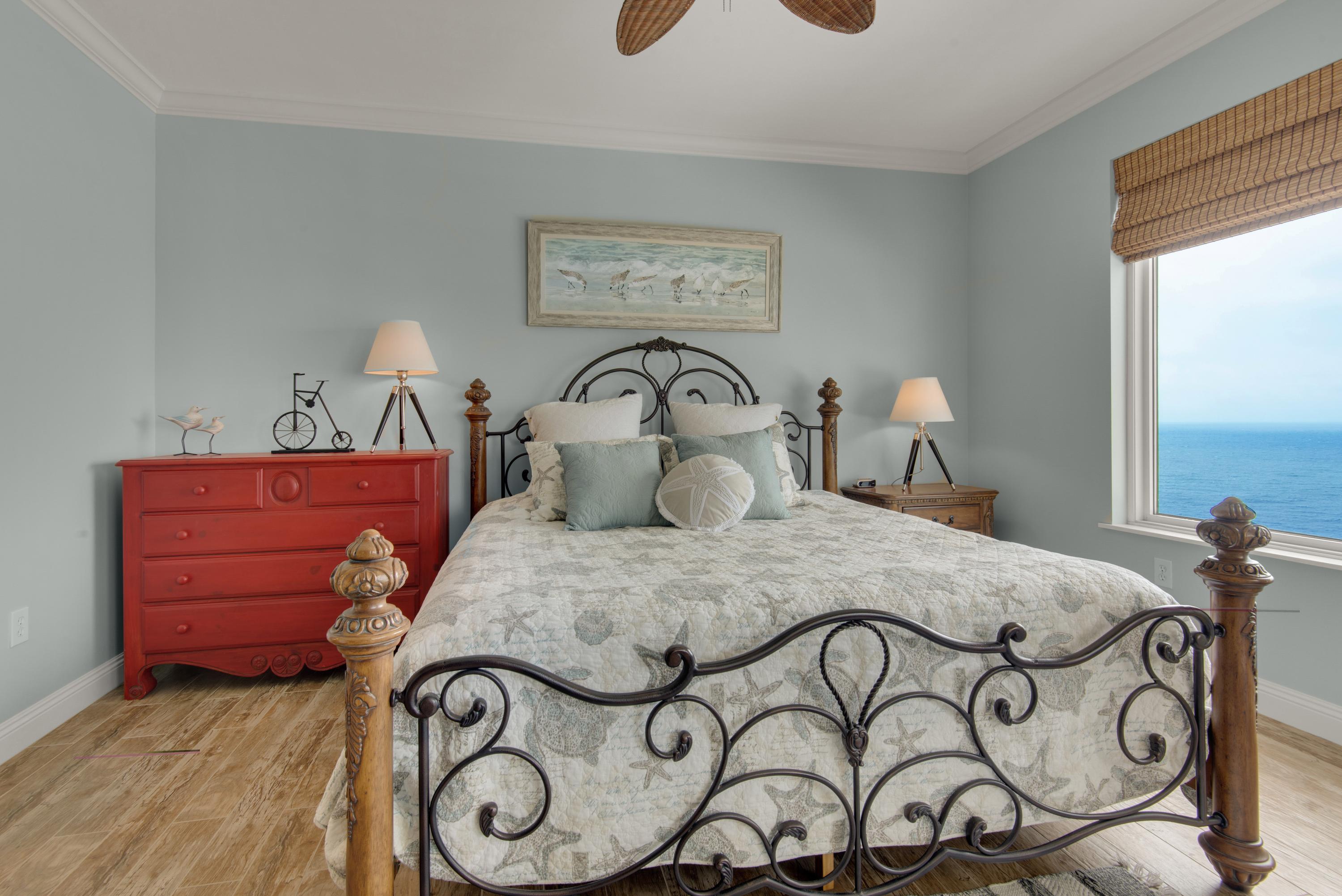 Tastefully decorated master bedroom with breathtaking views of the gulf waters