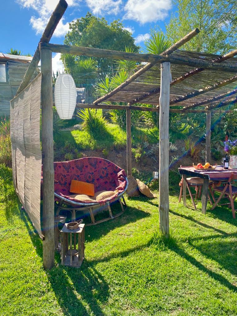 Partially shaded lounge area of the lotus glamping tent