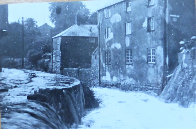 Waterside holiday property as it was 300 years ago showing the river running past and the the grand building where Waterside is a two bedroom holiday property within these  walls over two floors