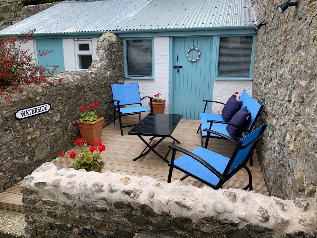 Courtyard garden and decking, stone wall, pretty sunny place to sit and relax south facing, at this central weekend getaway in Lyme regis 