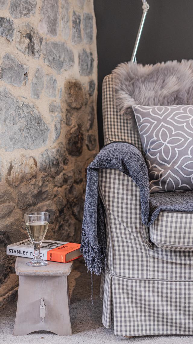 Easy chair in the lounge with reading light and footstool a perfect holiday relax for one or two people 