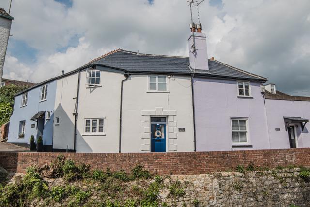 Central Lyme Regis on Sherborne Lane this 250 year old stable cottage sits next to the river Lym and Gosling Bridge nestled next to two other refurbished stable holiday properties