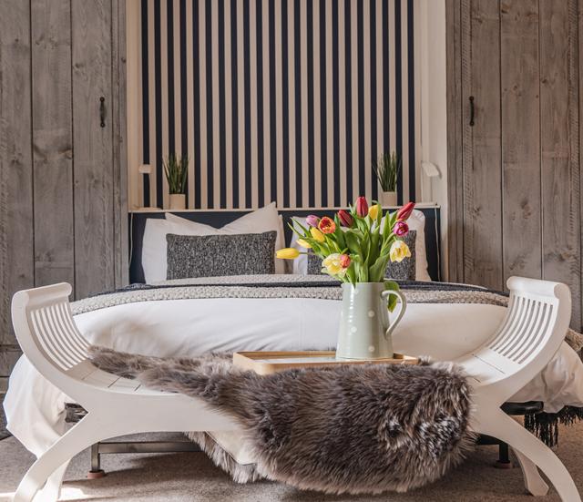 Luxury period holiday cottage spacious bedroom with double size bed and ample room to sit in the window and watch the river running by