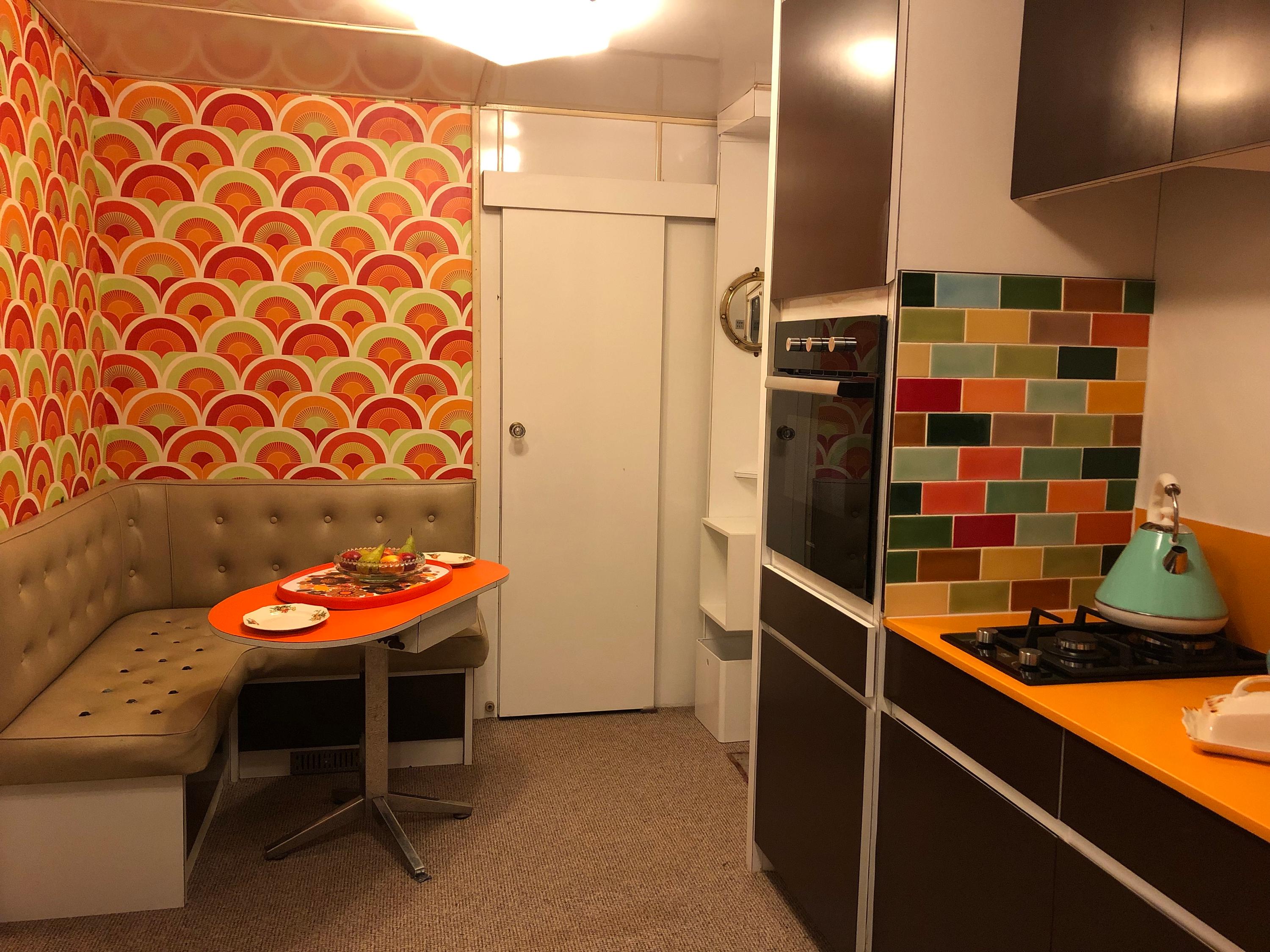 kitchen and dinning area with 70s style L-shape seating