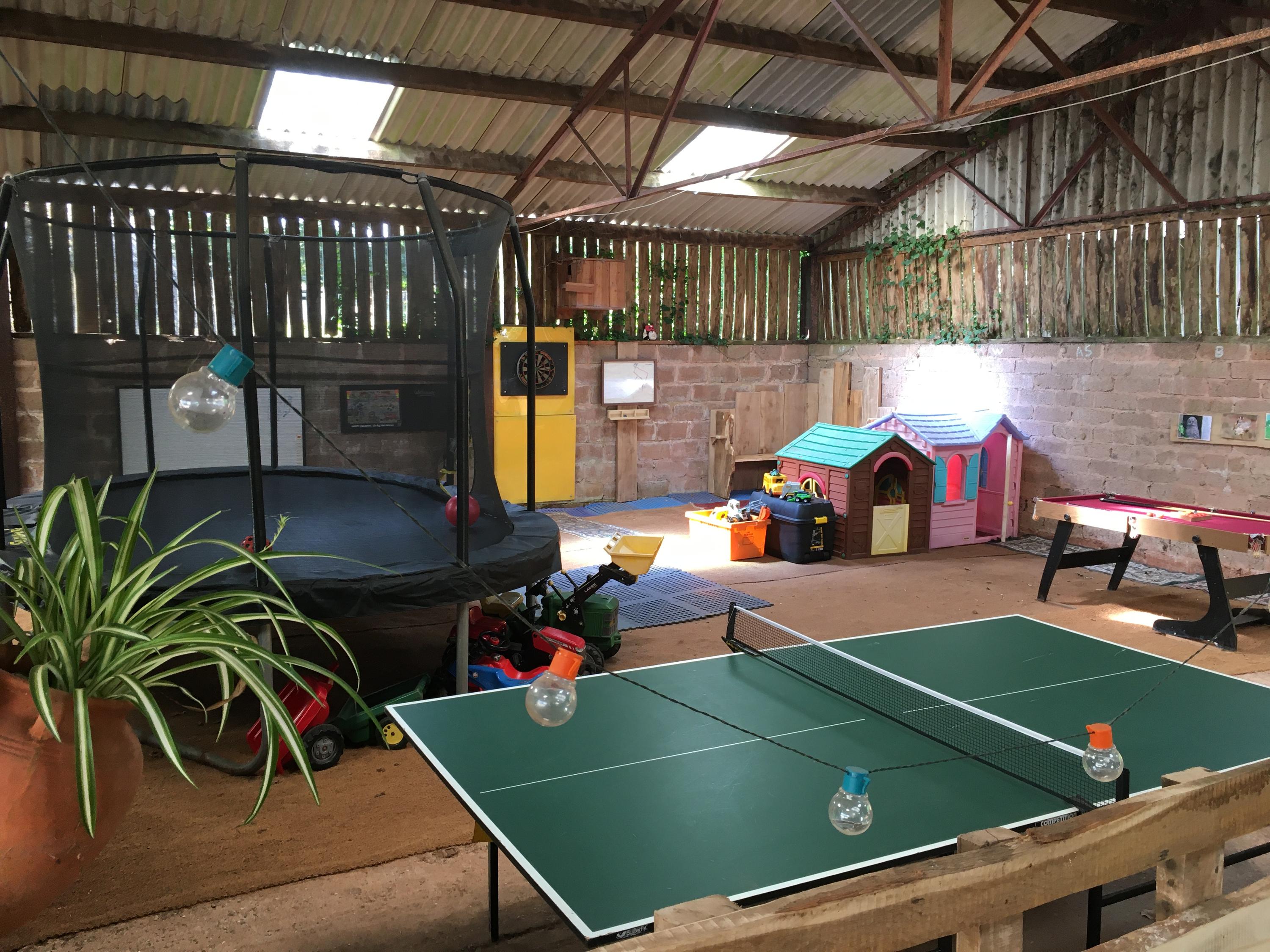 Private indoor play barn with trampoline, table tennis, snooker, darts, ride on toys and play houses