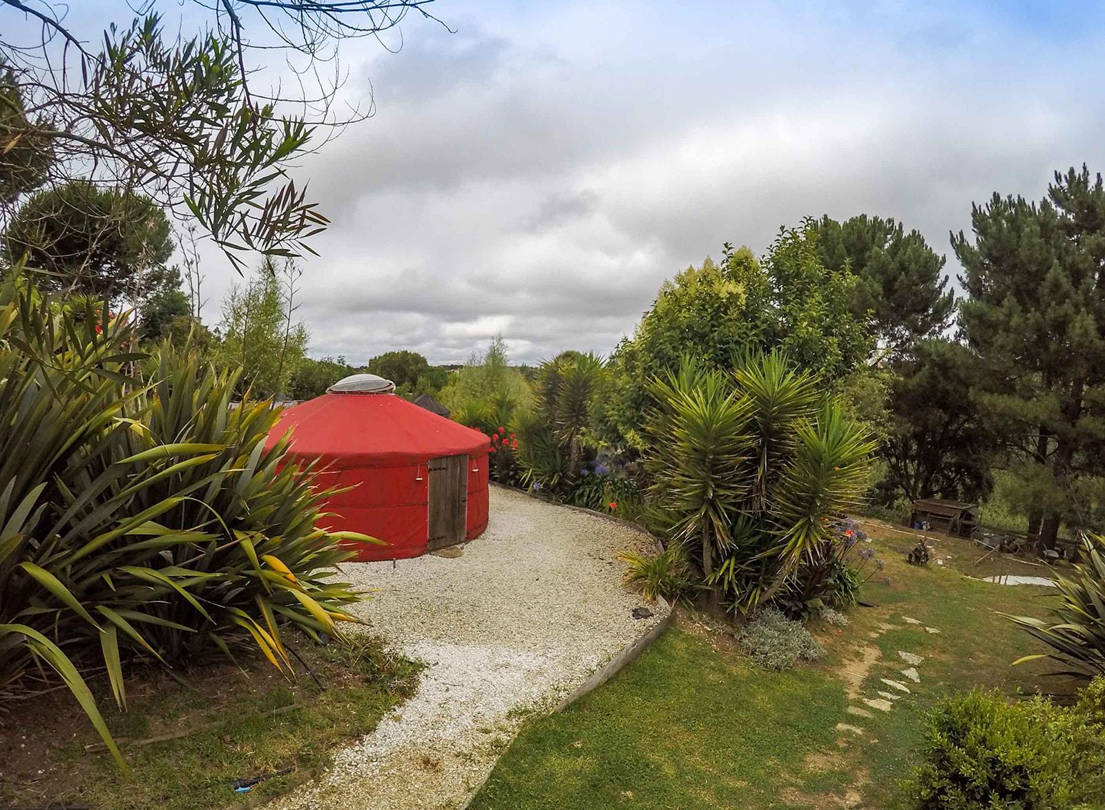 Red mongolian yurt tent photographed from the side