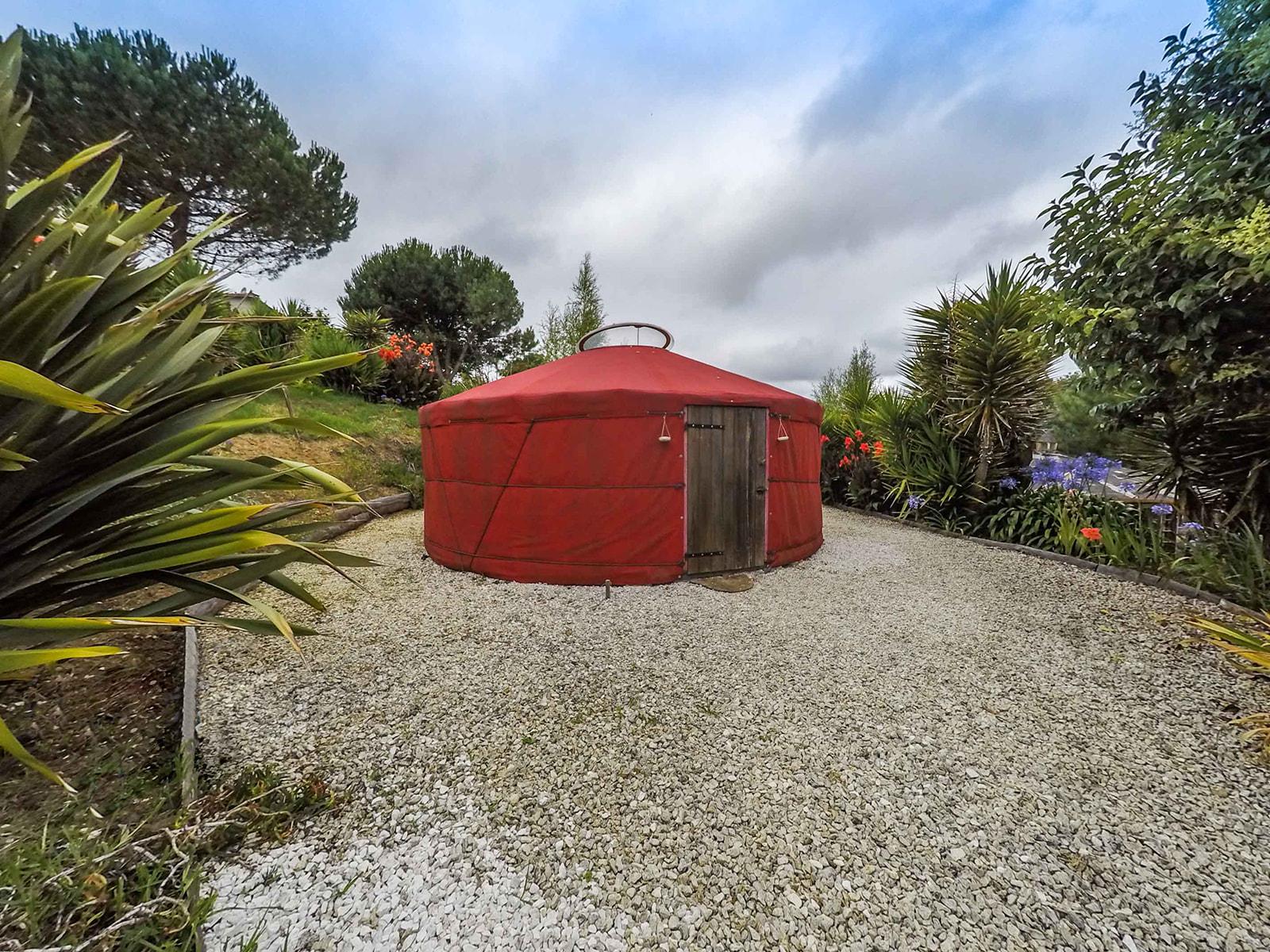 Red mongolian yurt tent photographed from the front