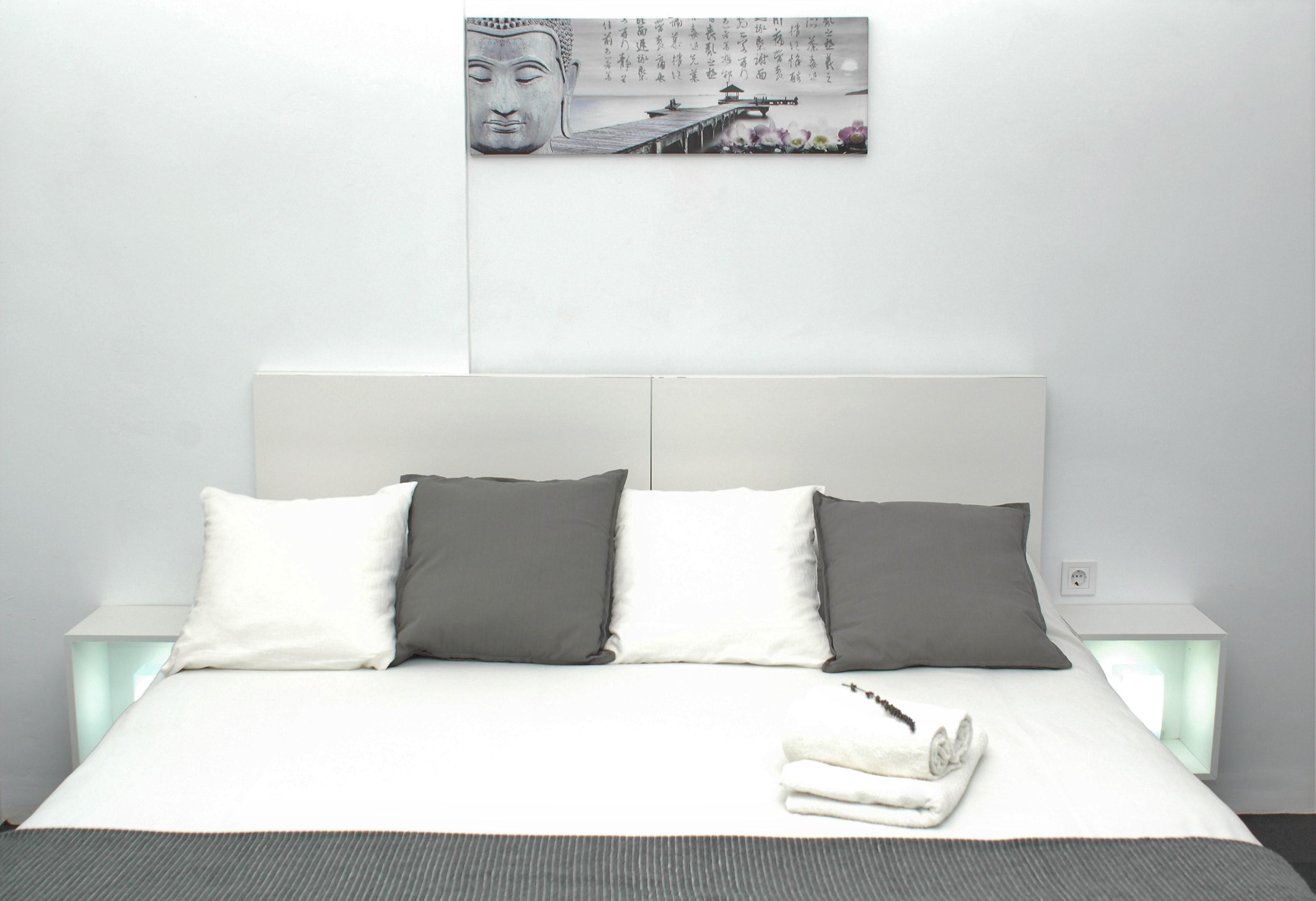 A spacious and serene room with a comfortable double bed.