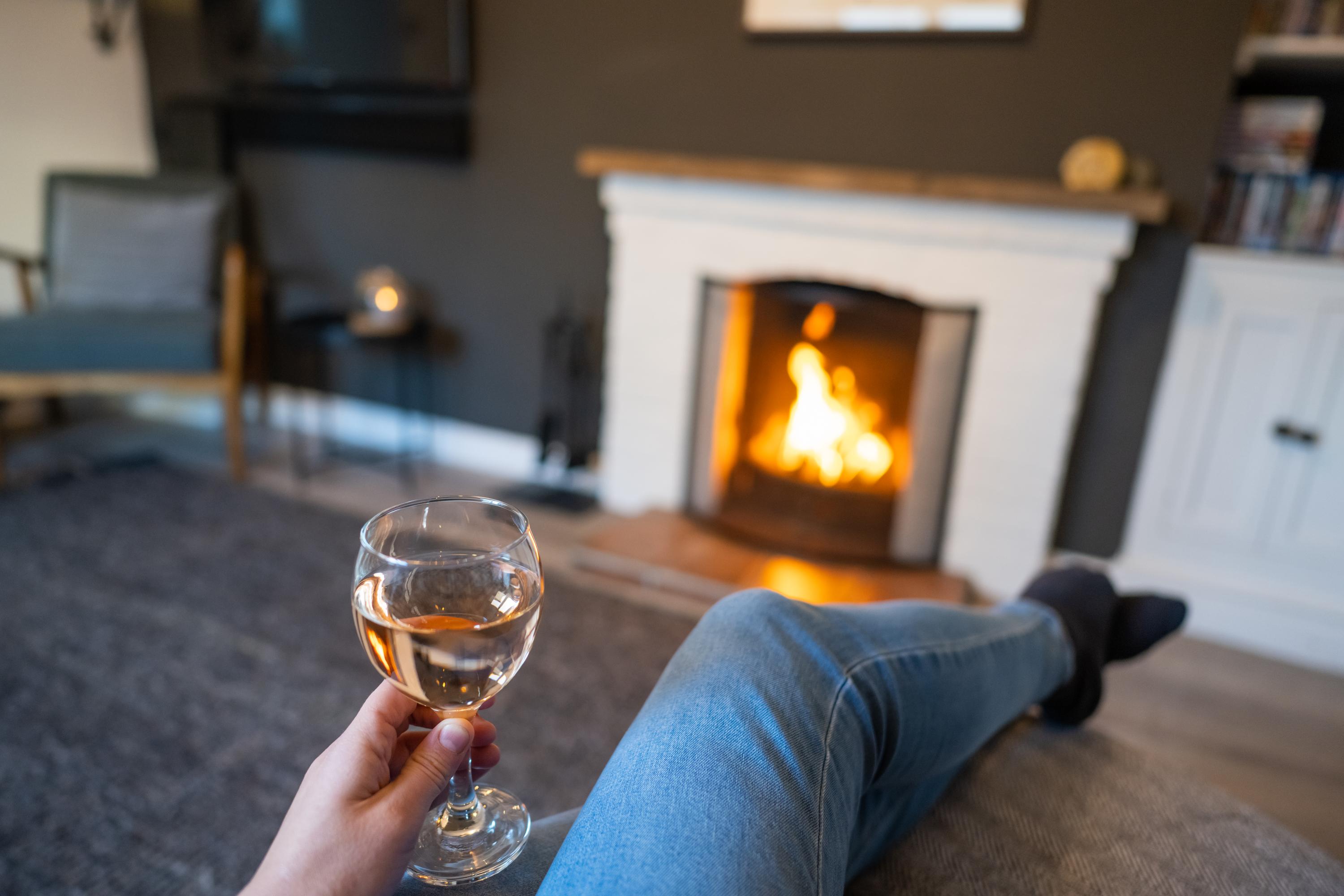 Sit on the chaise longue and drink a glass of wine  whilst wathcing the open fire or play on the play station controller