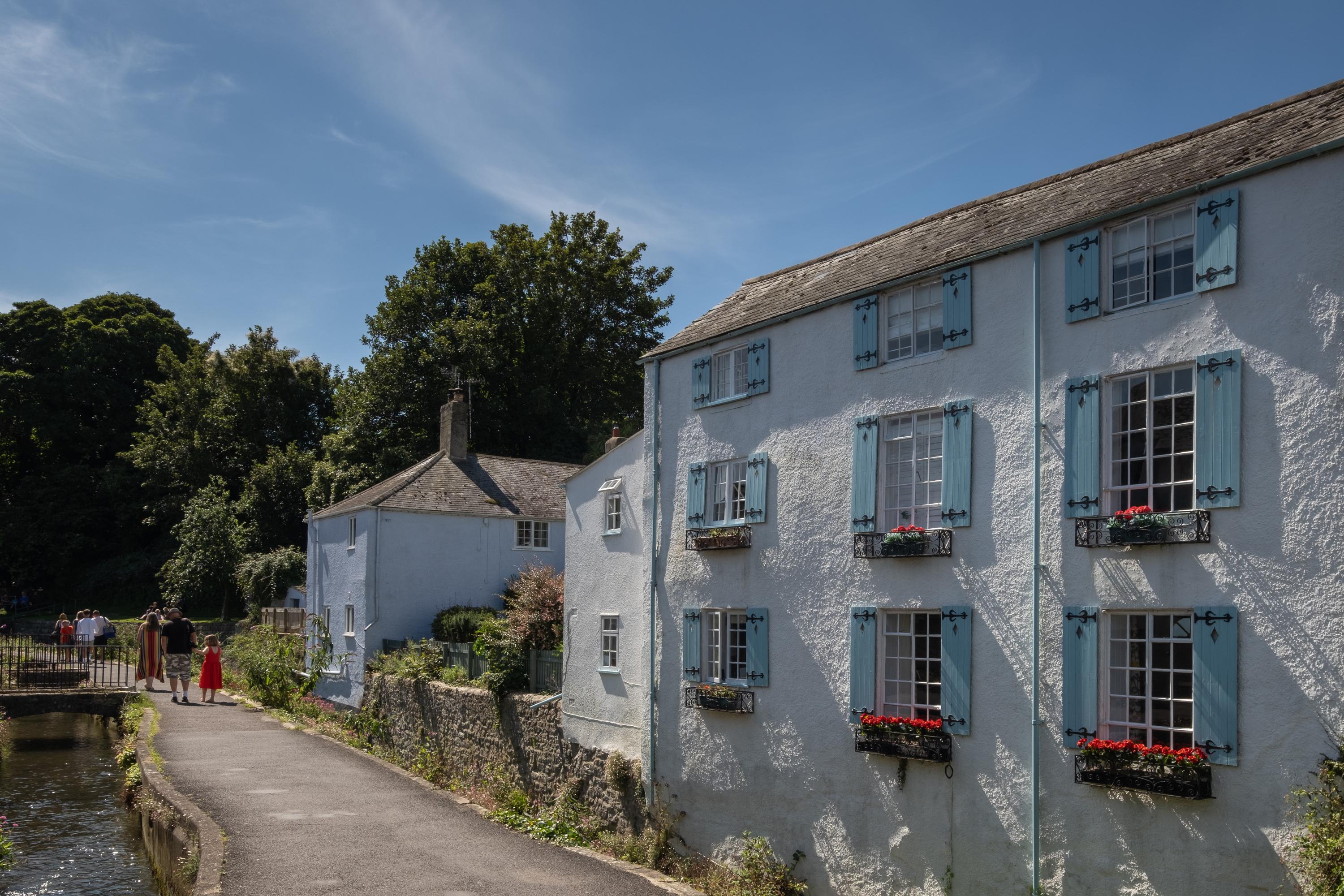 Three story, half of the whole French design holiday house with blue shutters, three bedrooms and three bathrooms, over looking the River Lym, a well photographed characterful holiday property  in Lyme Regis Dorset. 