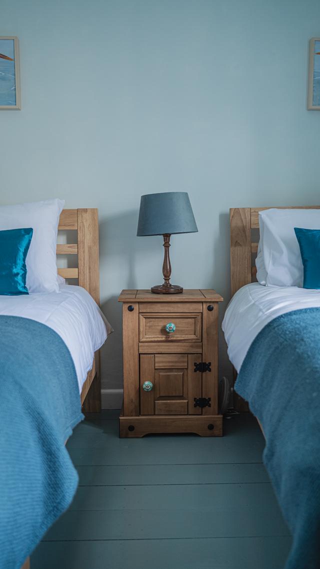 Twin beds in bedroom number three with views over the river Lym. Perfect for adults or children this is a perfect family holiday home, centrally located in Lyme Regis