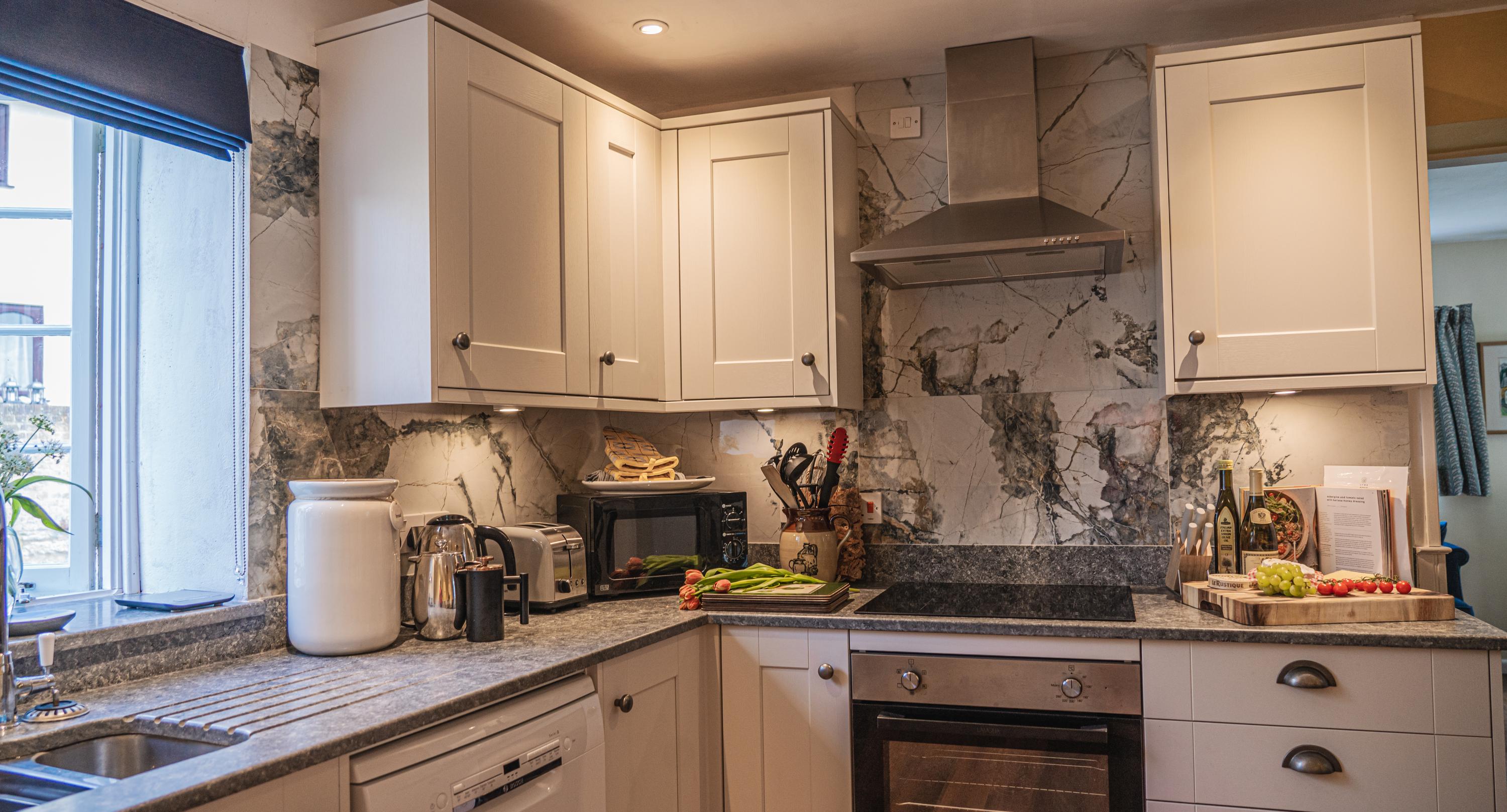 Holiday home bright airy kitchen stylish interiors with views over the river Lym