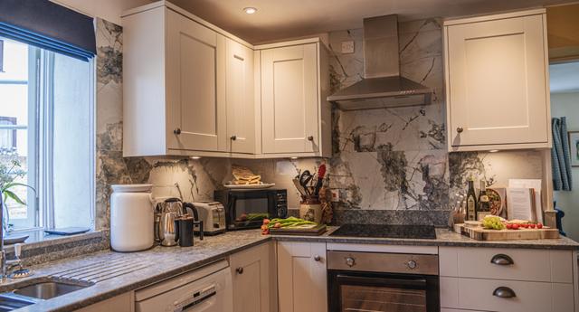 Holiday home bright airy kitchen stylish interiors with views over the river Lym