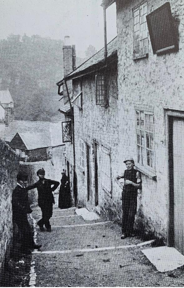Picture taken in days gone by of Seahorse Cottage showing how life was hundreds of years ago on Sherborne Lane in central Lyme Regis in this now holiday property
