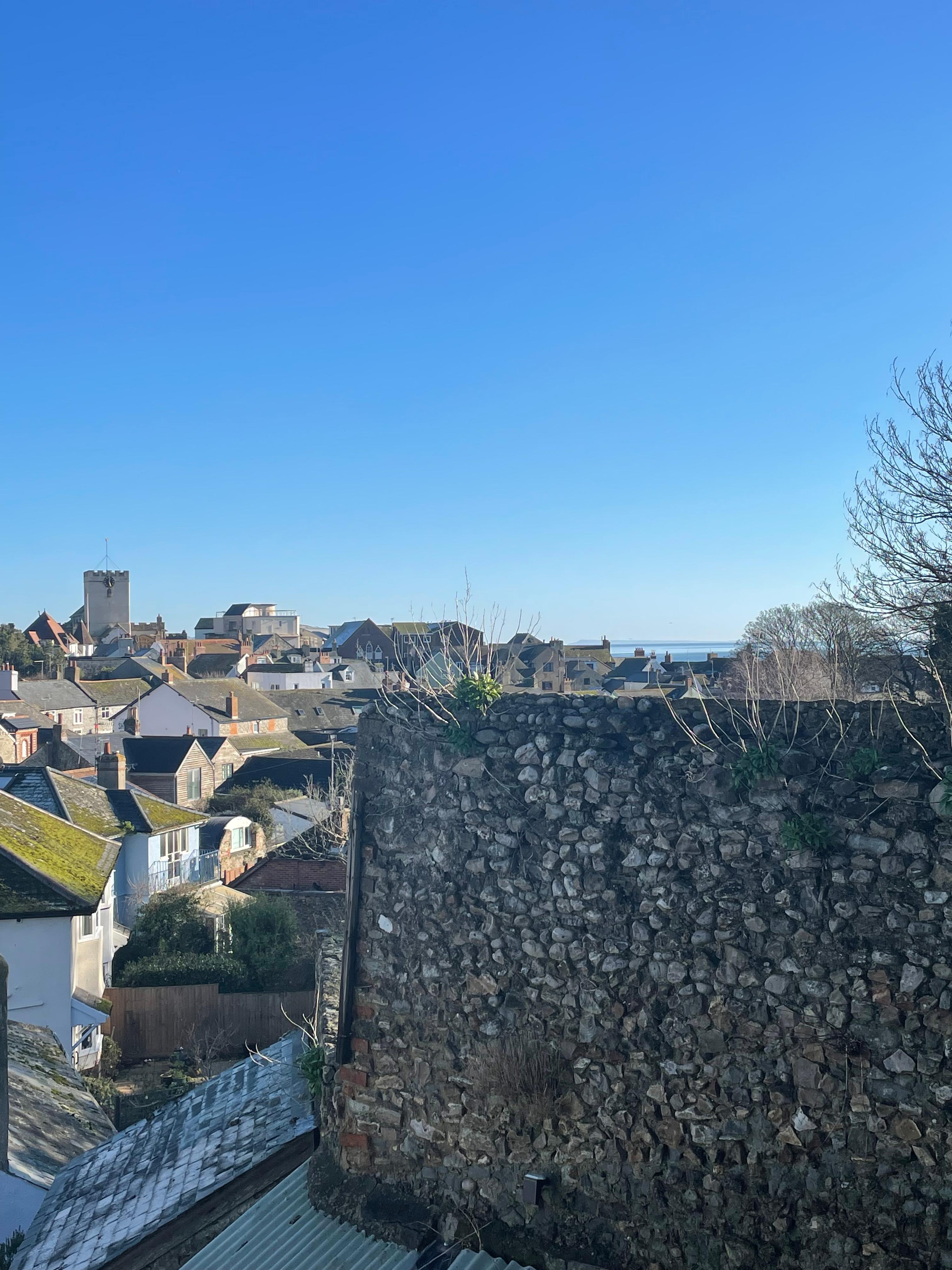 View from bed in the cosy master bedroom at Seahorse Cottage with views of the sea