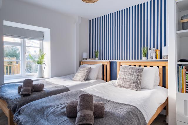 Window view of stylish twin bedroom onto Sherborne Lane in central Lyme Regis