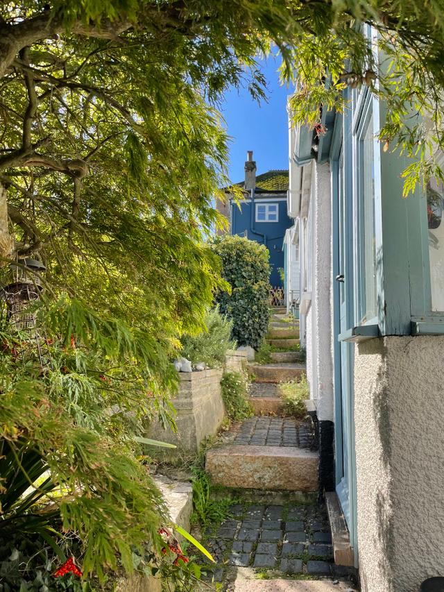 Back door entrance and steps up to Seahorse Cottage double garden doors 