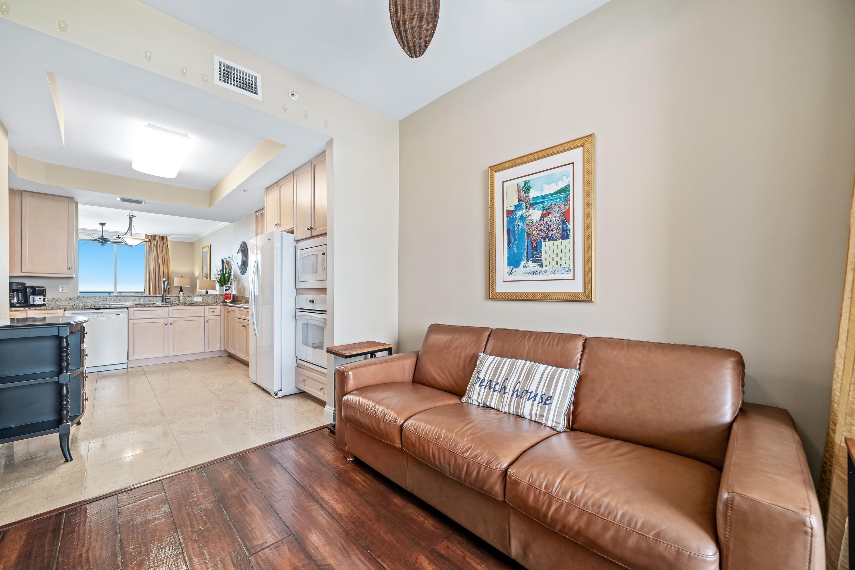 "Bonus Den" with Natuzzi Leather Sleeper Sofa that unfolds easily. Wall 50'' TV