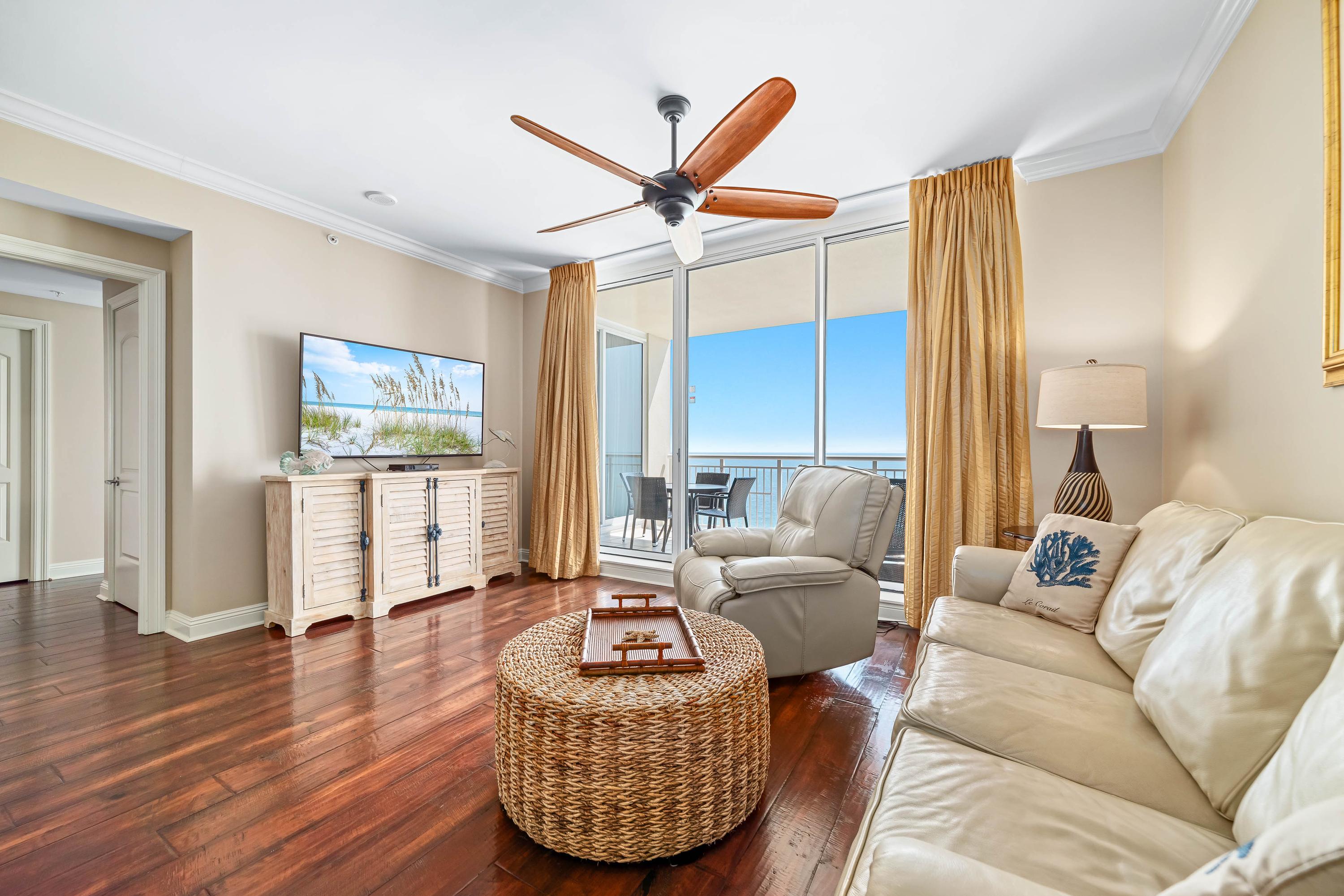 Leather seating & rich looking wood floors make this Living room quite inviting.