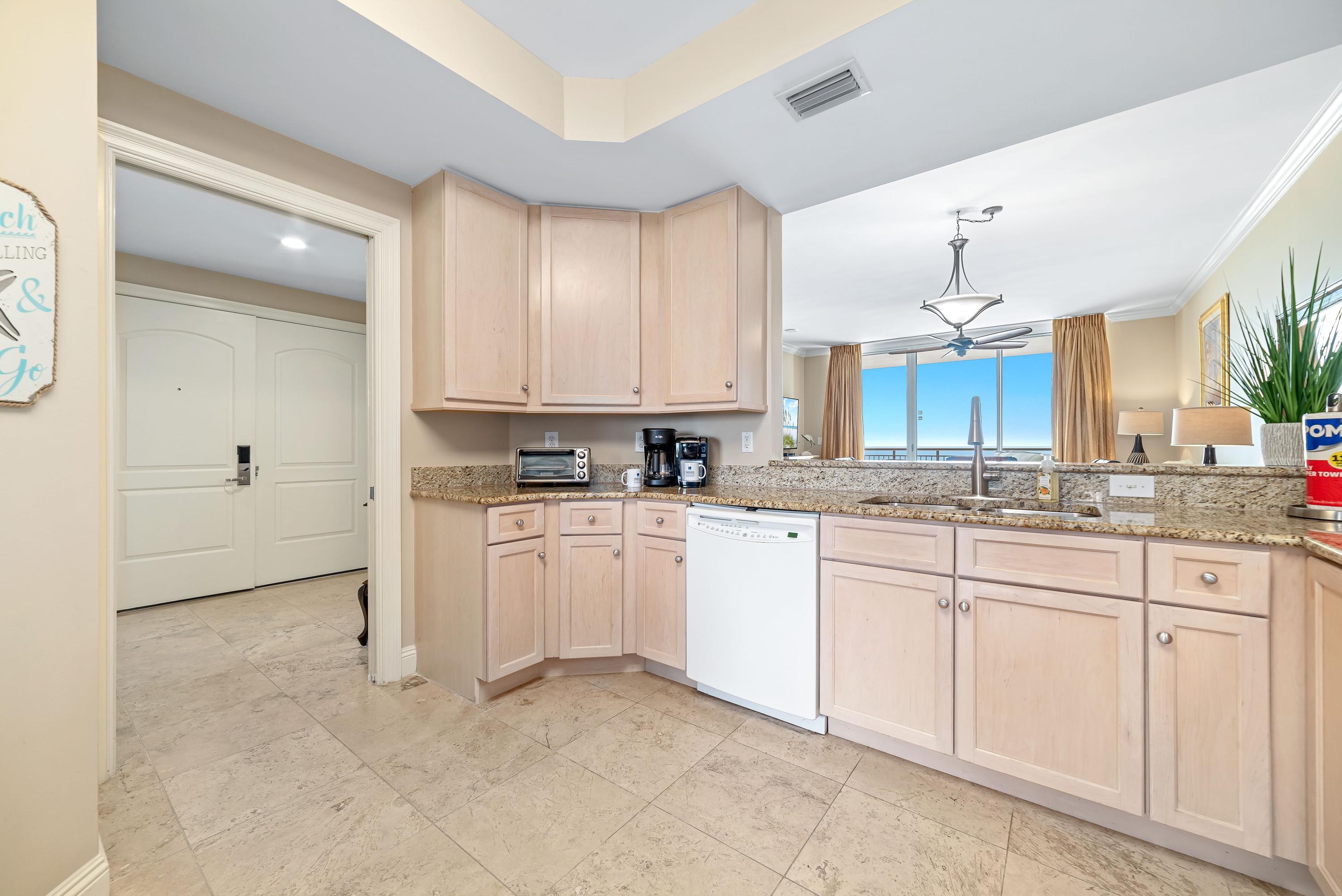 Kitchen angled to front foyer hallway