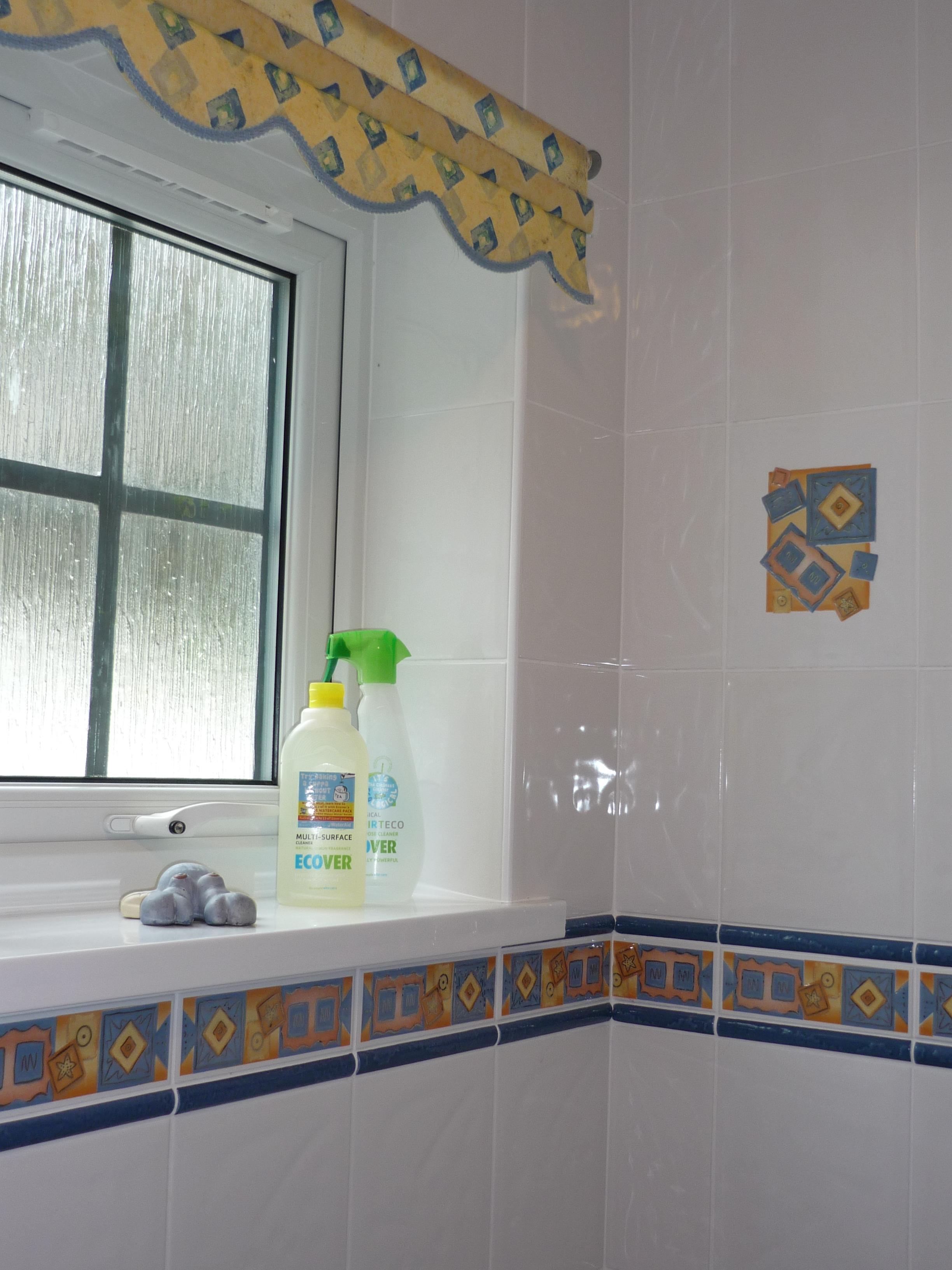 Bathroom with bath and electric shower