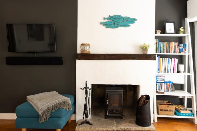 Interior view from kitchen to TCV and log burner hobbit stove with double windows to garden of this 18th century period holiday home in Lyme  Regis