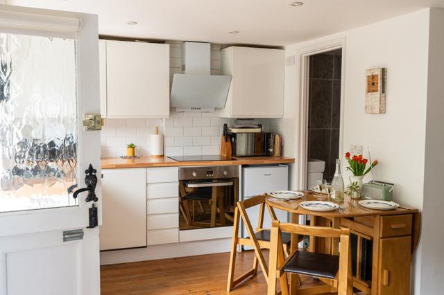 Pop up table and chairs for family dining at holiday let Lym River Cottage Lyme Regis