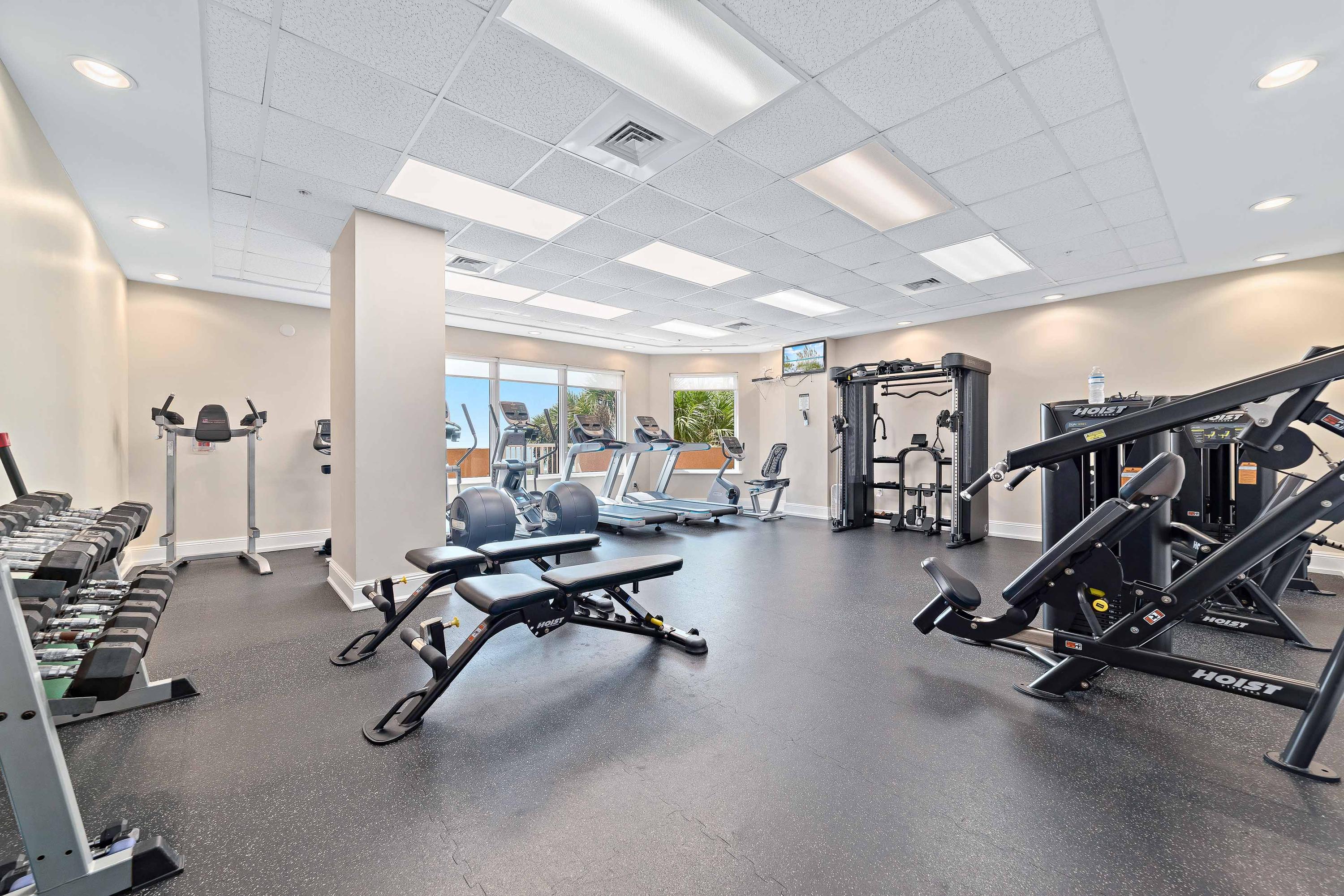 Very well-equipped Exercise Room, featuring new equipment, treadmills, dumbbells