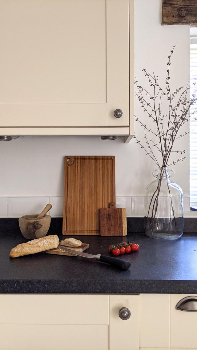 Contemporary holiday home cottage kitchen off hallway with washing machine 