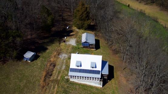 Drone overhead view of farmhouse and cottage