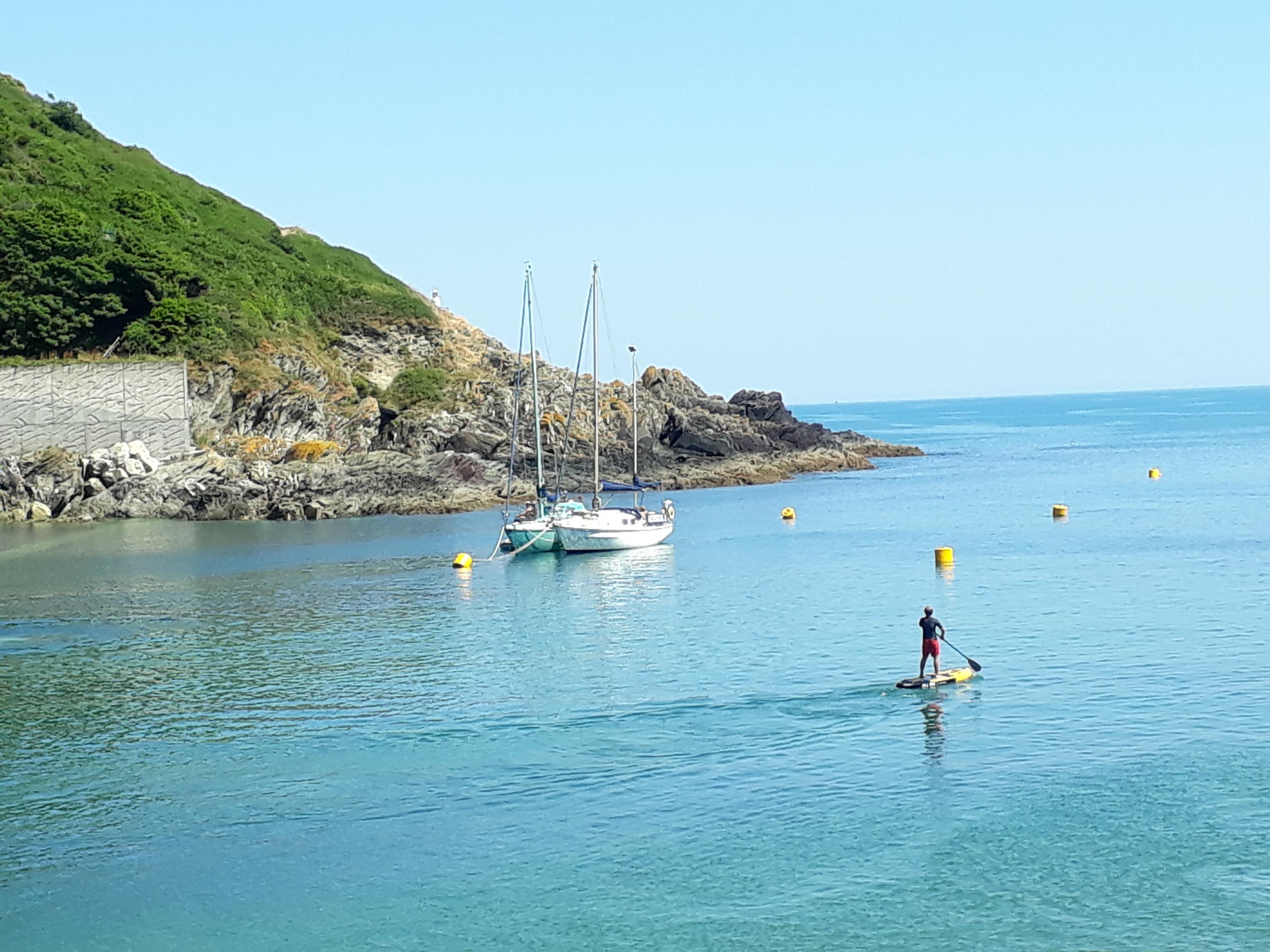 Paddle boarding off Polperro Beach