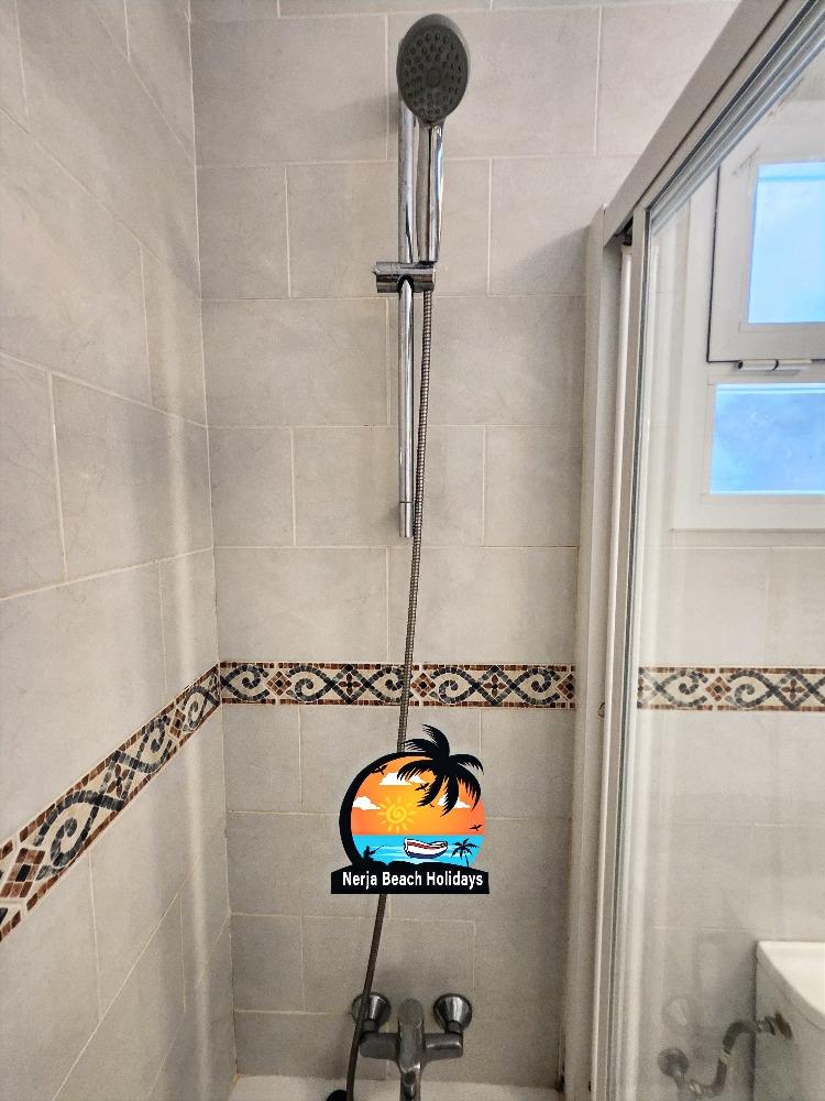 Bathtub with overhead shower