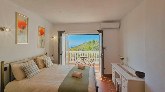 Slaapkamer met terras van vakantiehuis