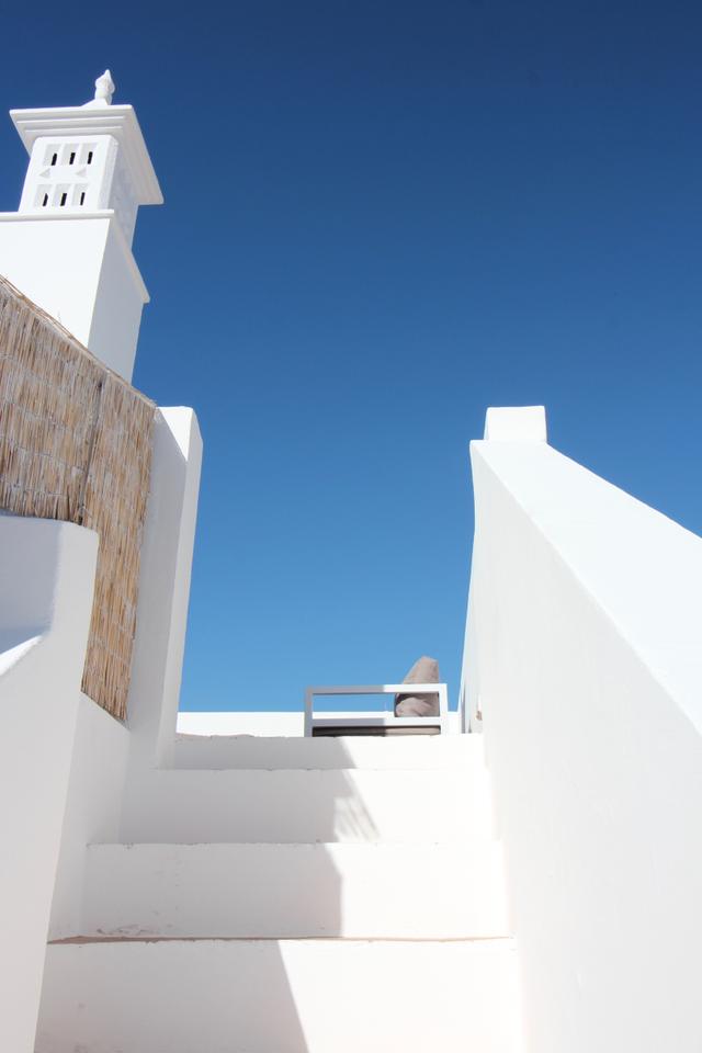 Private rooftop terrace at Casa Opala with lounge seating and city views