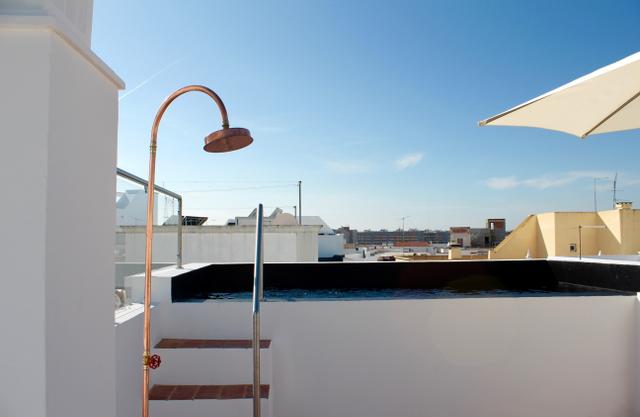 Outdoor shower on the rooftop terrace at Casa Opala