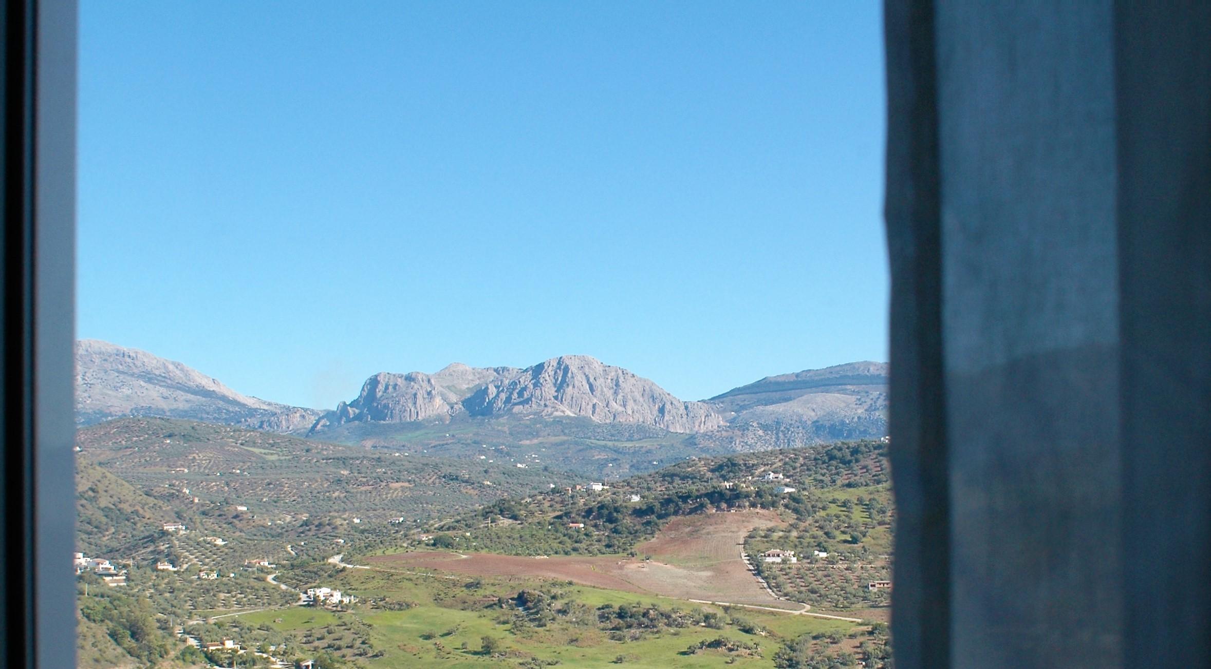 Wake up to soft light and peaceful mountain views.