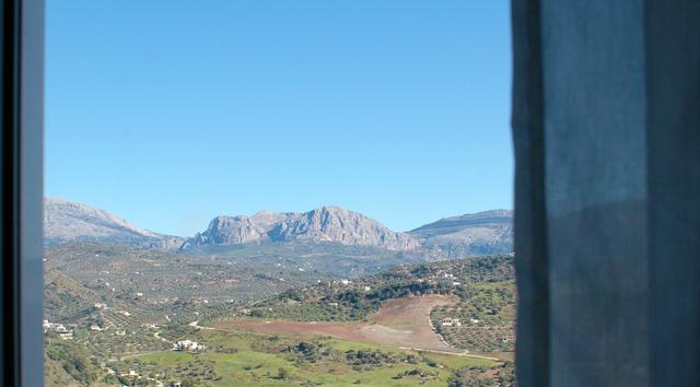 Wake up to soft light and peaceful mountain views.